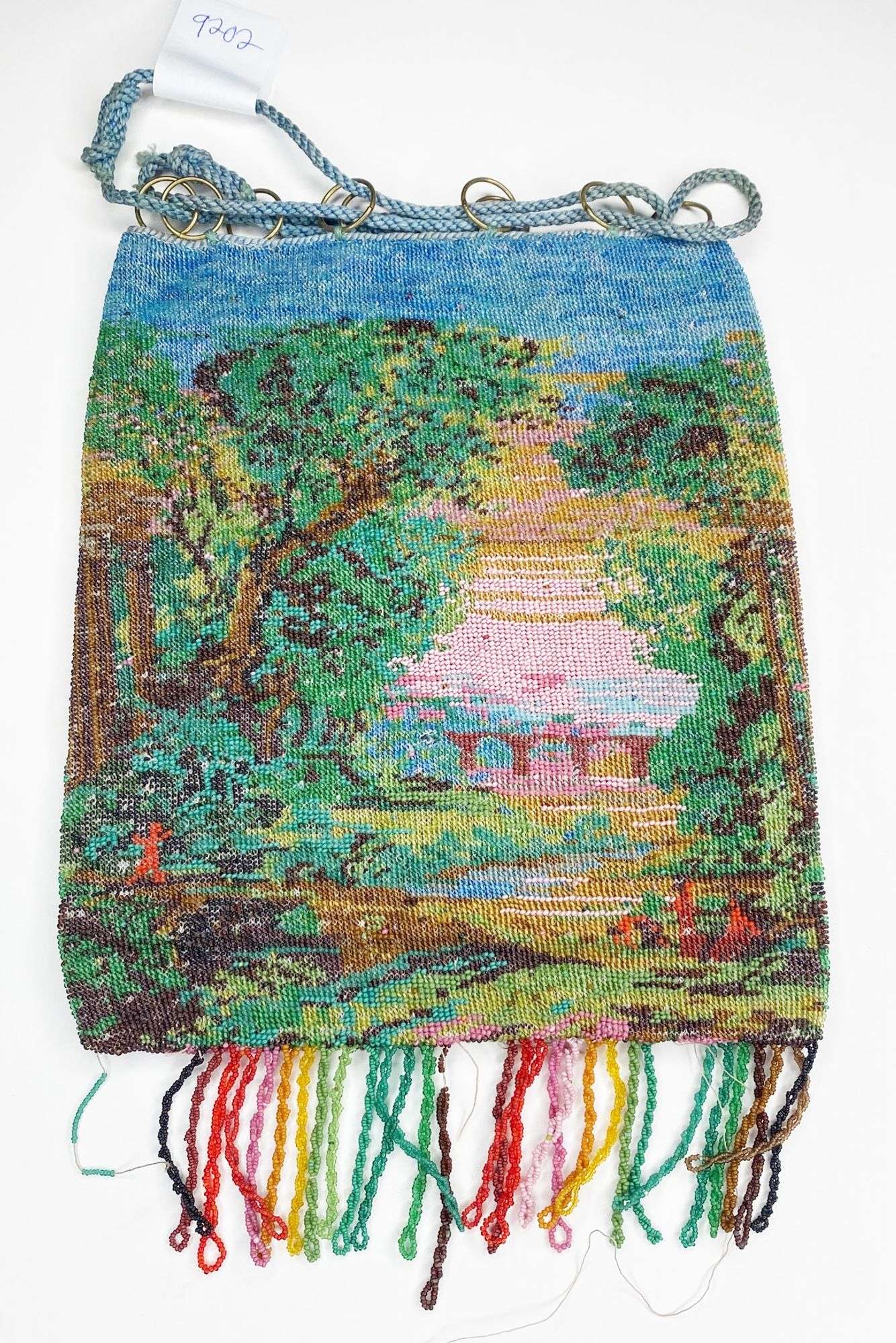 Appraisal: Micro Beaded Draw String Bag with Wooded Bridge Scene long