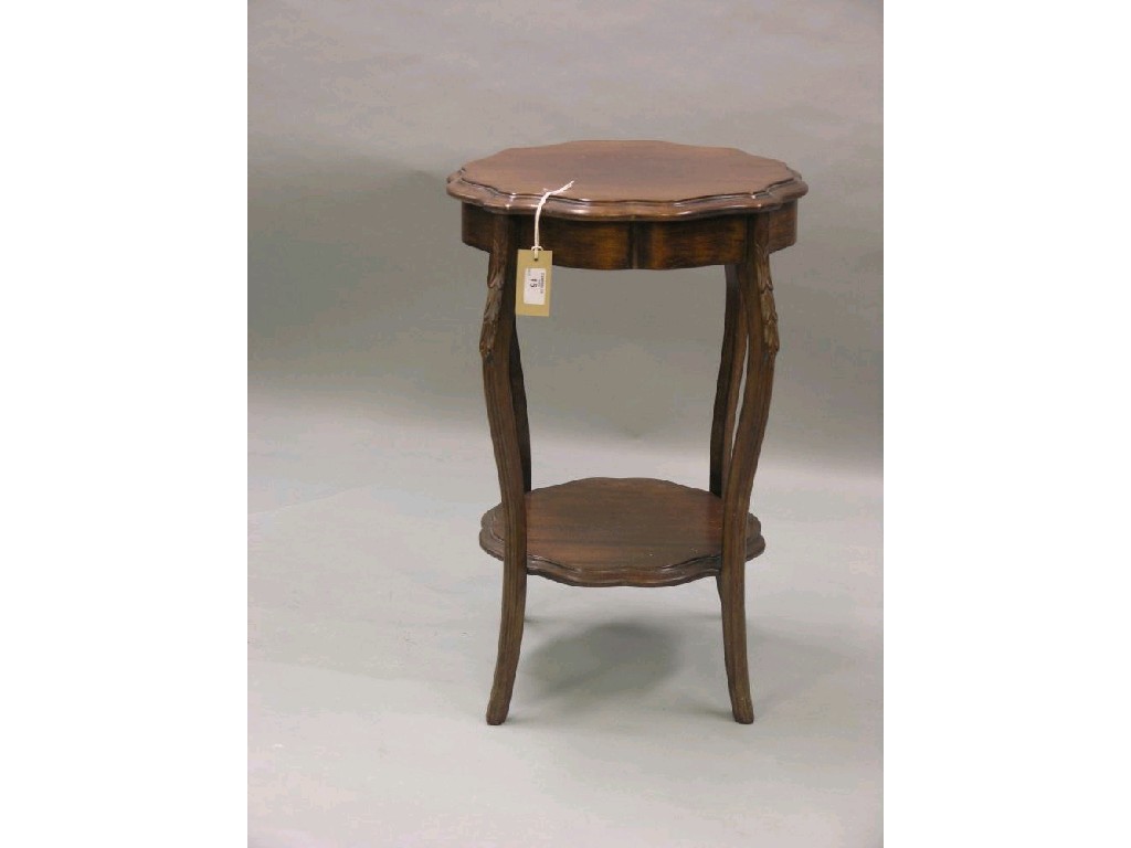 Appraisal: A small Edwardian mahogany occasional table lobed circular top on