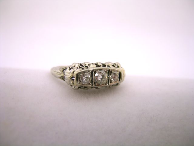 Appraisal: Vintage sterling silver filigree diamond ring set with three round