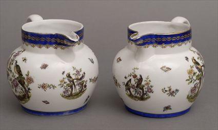 Appraisal: PAIR OF AUSTRIAN TRANSFER-PRINTED PORCELAIN MILK JUGS One with underglaze