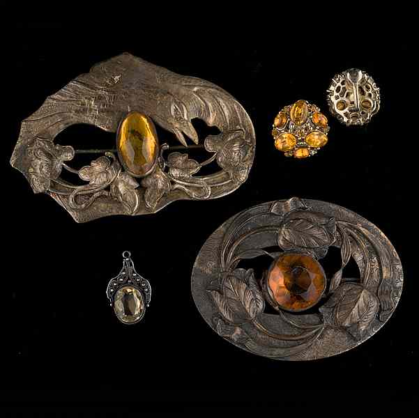 Appraisal: Unsigned silver brooches ear clips and a pendant A grouping