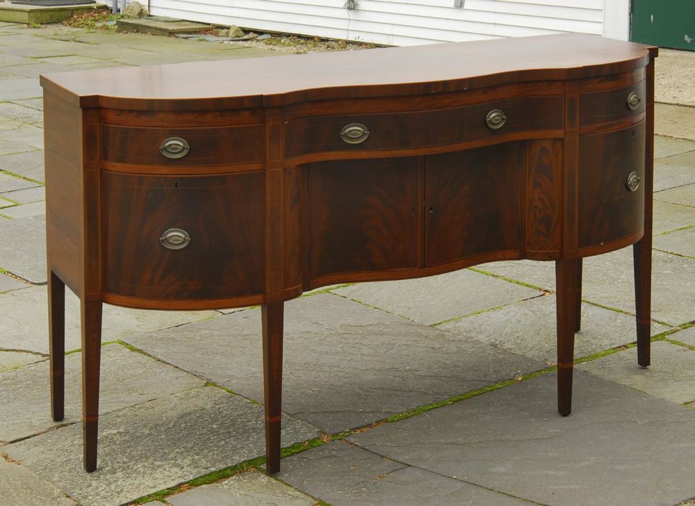 Appraisal: ANTIQUE AMERICAN HEPPLEWHITE SERPENTINE-FRONT SIDEBOARD Circa In mahogany with with