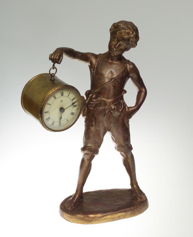 Appraisal: NOVELTY SPELTER MANTLE CLOCK MODELLED AS A STANDING BOY with