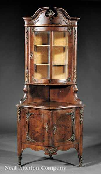 Appraisal: An Antique Continental Walnut and Gilt Metal-Mounted Corner Vitrine th