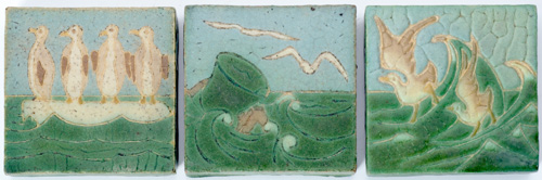 Appraisal: GRUEBY Frieze of three tiles decorated in cuenca with penguins