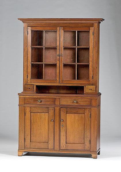 Appraisal: PENNSYLVANIA DUTCH CUPBOARD Pennsylvania early th century two-part walnut Dutch