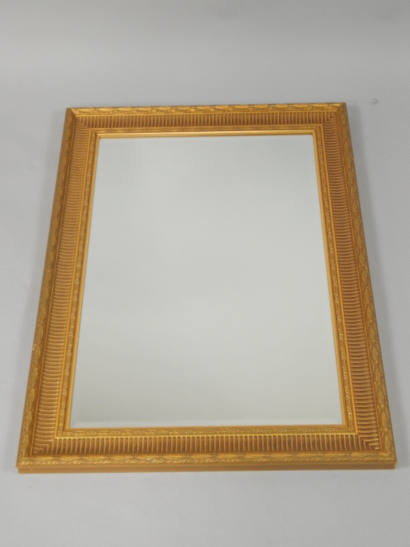 Appraisal: A rectangular gilt wall mirror inset bevelled glass cm x