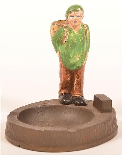 Appraisal: Hubley Trapper Boy Ash Tray and Match Holder Hubley Cast