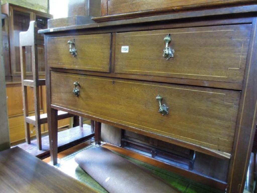 Appraisal: An Edwardian mahogany bedroom chest fitted with one long and