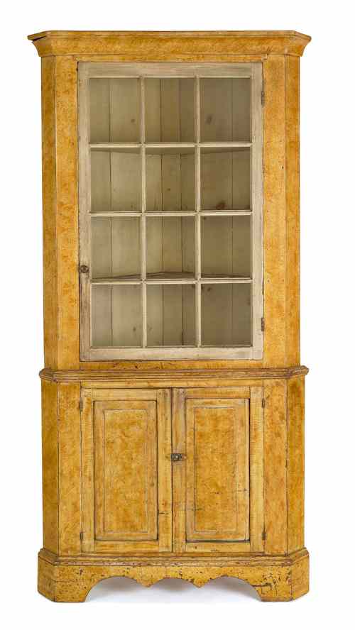 Appraisal: Pennsylvania painted two-part corner cupboard early th c the ogee