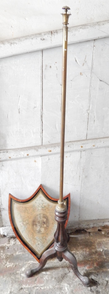 Appraisal: A Victorian walnut pole screen with shield screen and tripod