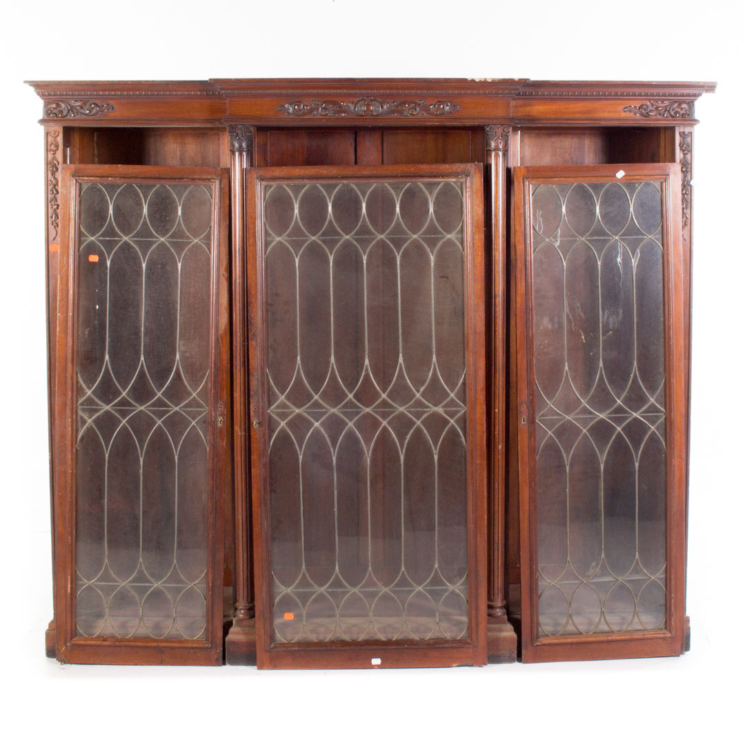 Appraisal: Classical Revival mahogany three-door bookcase leaded glass doors in H