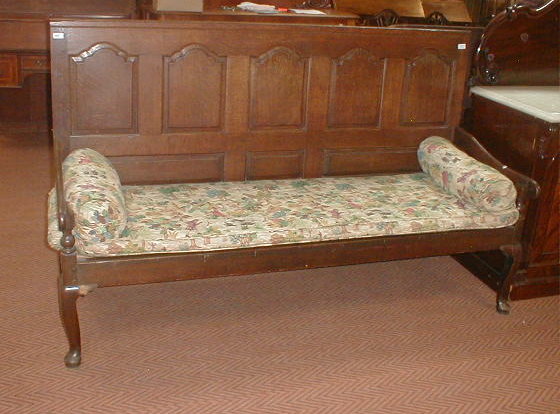 Appraisal: An early thC oak settle with five fielded panel back