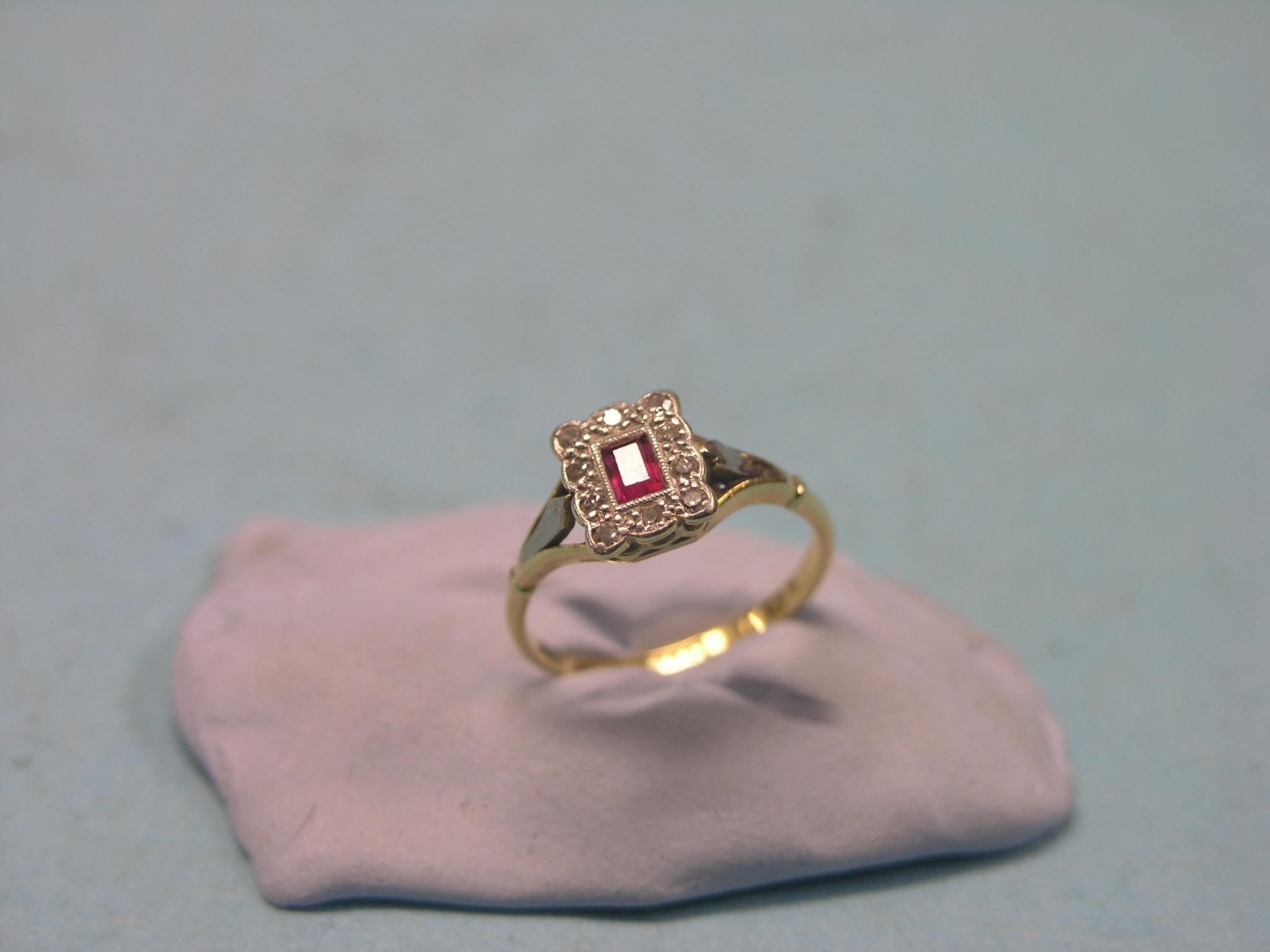 Appraisal: A gold diamond and ruby ring ten small diamonds and