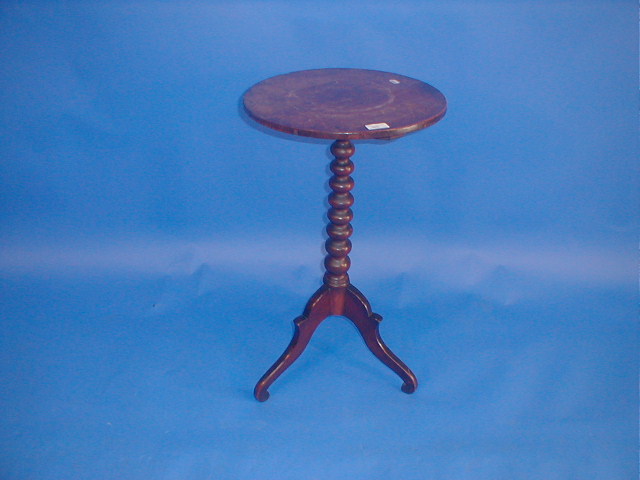 Appraisal: A Victorian oak tripod table with circular top taper ball