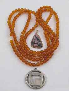 Appraisal: An amber necklace a silver pendant and a ct gold