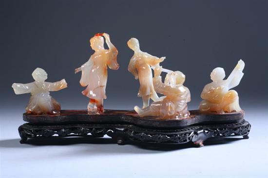 Appraisal: FIVE CHINESE AGATE FIGURES OF MUSICIAN Standing on carved wood