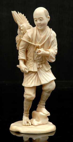 Appraisal: A JAPANESE IVORY OKIMONO OF A FARMER Meiji Period -