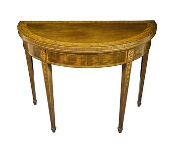 Appraisal: A George III mahogany semi-circular card table the top crossbanded