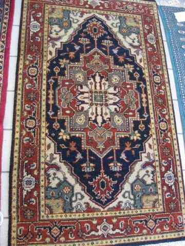 Appraisal: Heriz Persian Handmade Rug centralmedallion indigo trim stylized floral border