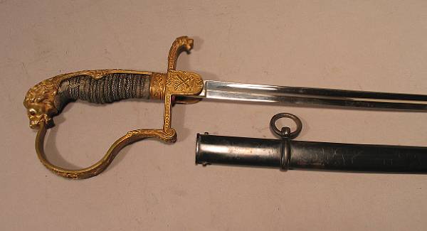 Appraisal: An Imperial German artillery officer's sword Slender curved inch nickeled