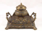 Appraisal: A Victorian cast brass ink stand the central well of