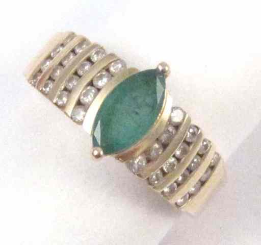 Appraisal: EMERALD DIAMOND AND FOURTEEN KARAT GOLD RING set with a