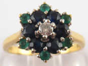 Appraisal: A yellow metal tests carat gold diamond emerald and sapphire