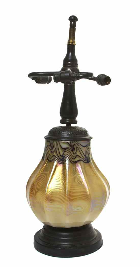 Appraisal: An American Bronze and Iridescent Glass Lamp Base the ribbed