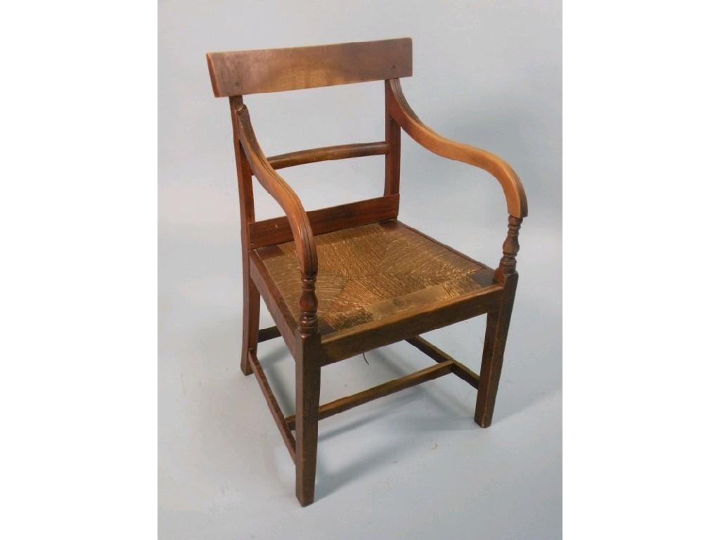 Appraisal: An early thC fruitwood open armchair with a plain bar