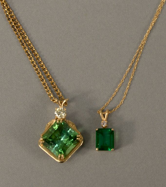 Appraisal: Two karat pendants each set with green stone one also