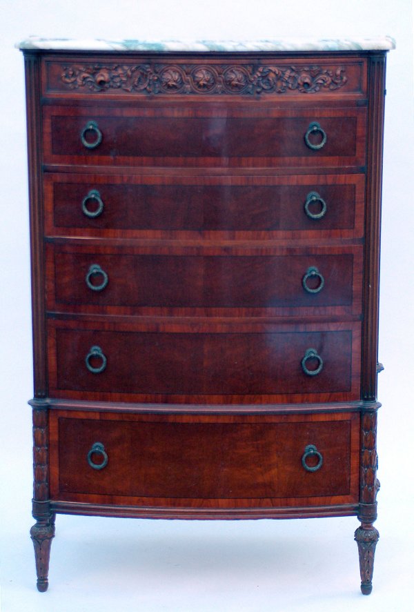 Appraisal: Chest of drawers Banded mahogany bowfront carved top fluted and