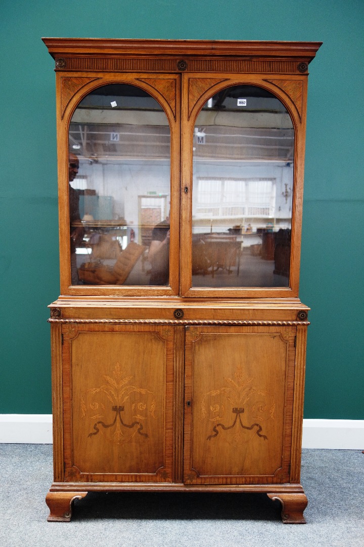 Appraisal: An early th century marquetry inlaid satinwood and walnut display