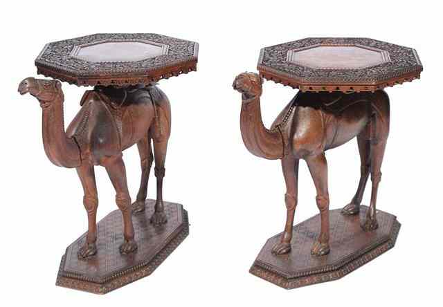 Appraisal: A PAIR OF EGYPTIAN CARVED HARDWOOD OCTAGONAL TOP OCCASIONAL TABLES