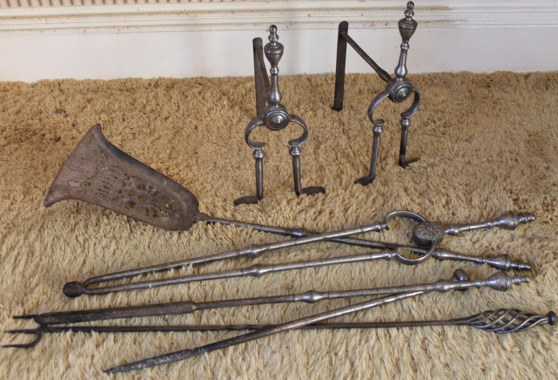 Appraisal: A set of polished steel fire tools with andirons