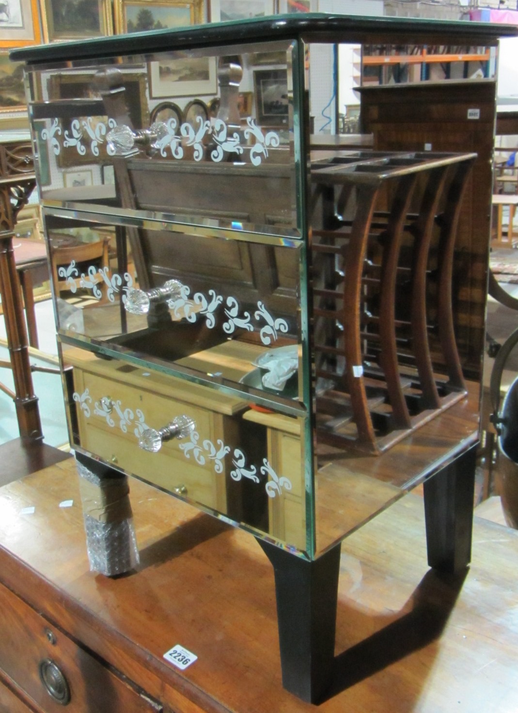 Appraisal: A th century mirrored chest of three drawers