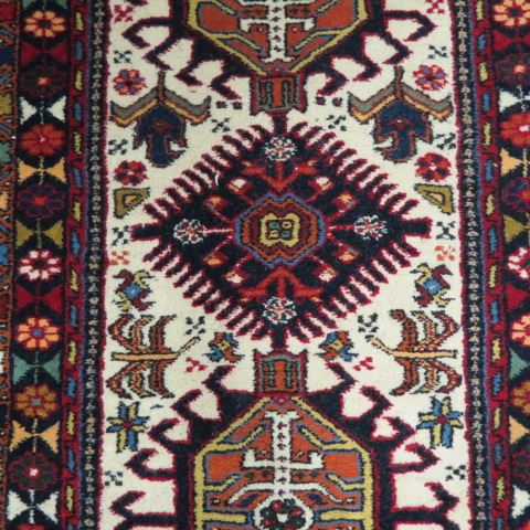 Appraisal: Heriz Persian Handmade Rug interesting geometric designs on ivory field