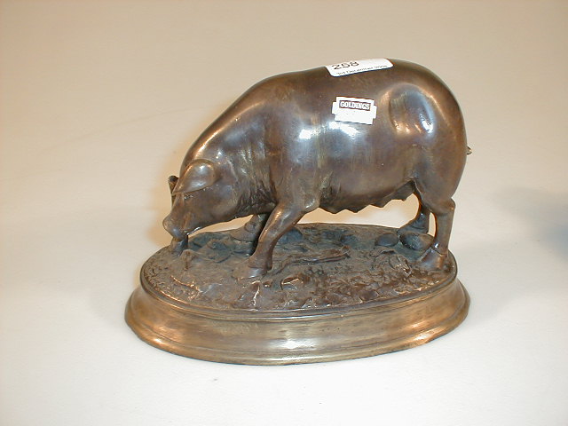 Appraisal: A modern bronze patinated model of a sow the oval