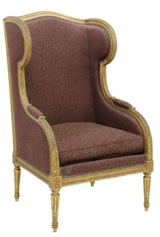 Appraisal: French Louis XVI style wingback armchair early th c giltwood