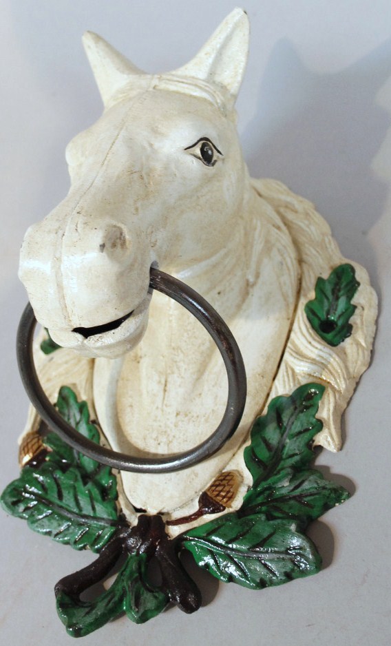 Appraisal: A modern metal horse door knocker in green gilt and