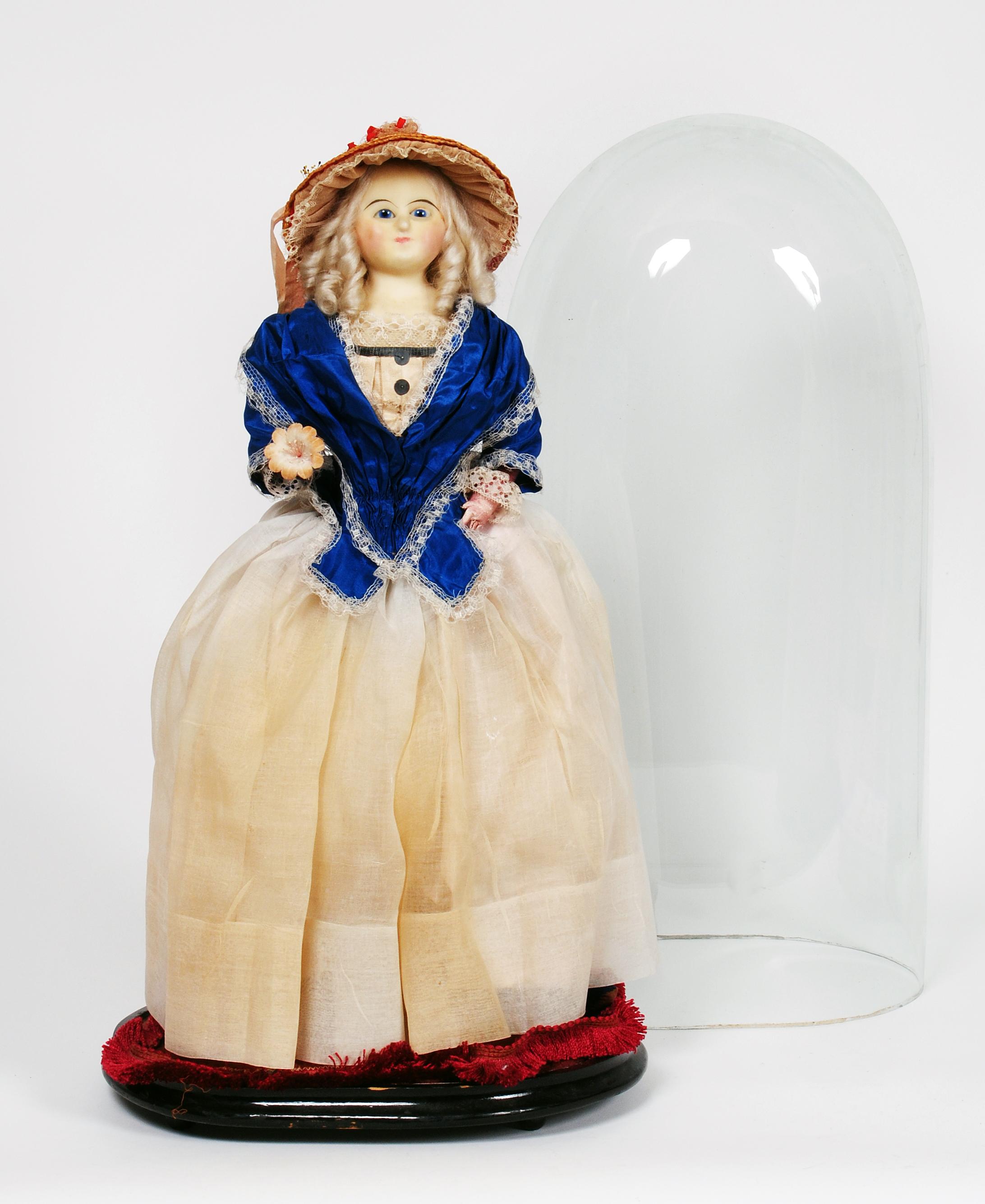 Appraisal: A late th century wax shoulder head doll with fixed