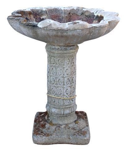 Appraisal: English cast stone birdbath thc havIing a shell form bowl