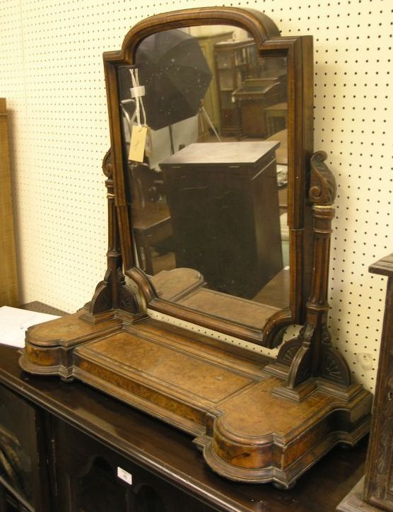 Appraisal: A Victorian burr walnut dressing mirror architectural form with fluted