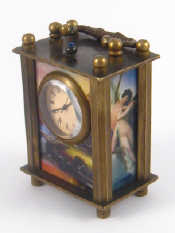 Appraisal: A miniature carriage clock the sides and back with panels