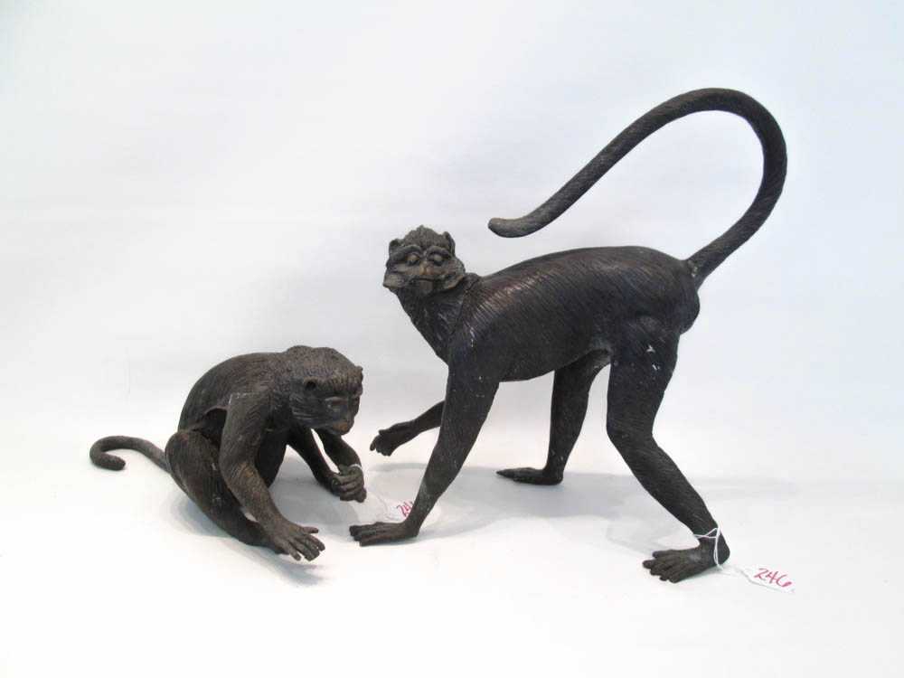 Appraisal: TWO BRONZE SPIDER MONKEY SCULPTURES one walking and the other