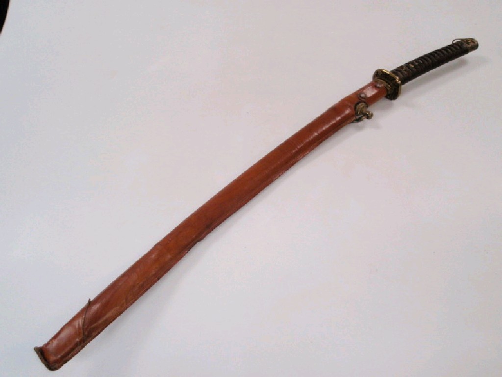 Appraisal: A Samurai sword with leather sheathed scabbard