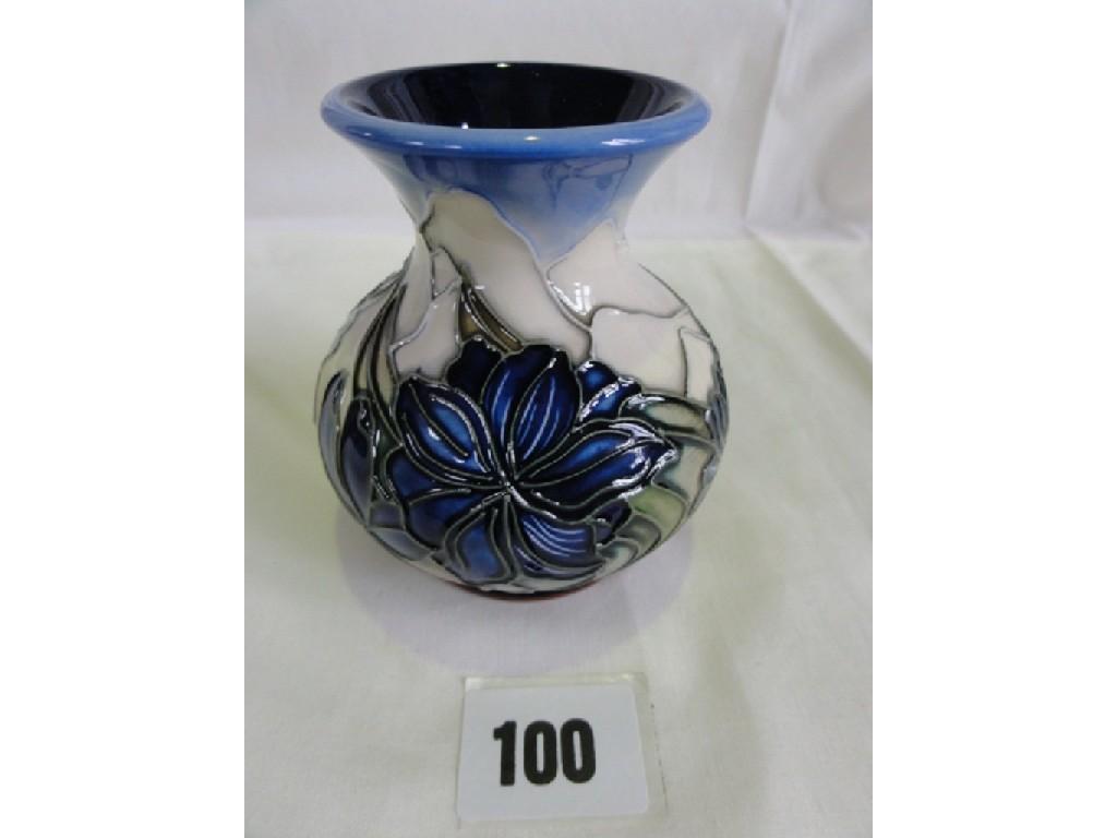 Appraisal: A small Moorcroft Pottery vase with painted and moulded blue