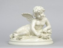 Appraisal: Italian Reclining Cherub circa th Century Porcelain figurine of a