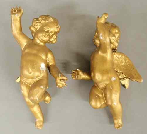 Appraisal: Pair of metal putti with gilt paint decoration h each