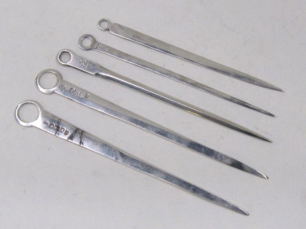 Appraisal: Lot comprising four silver meat skewers assorted marks and one